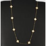 A matching 18ct yellow gold mother of pearl set necklace, L. 54cm.
