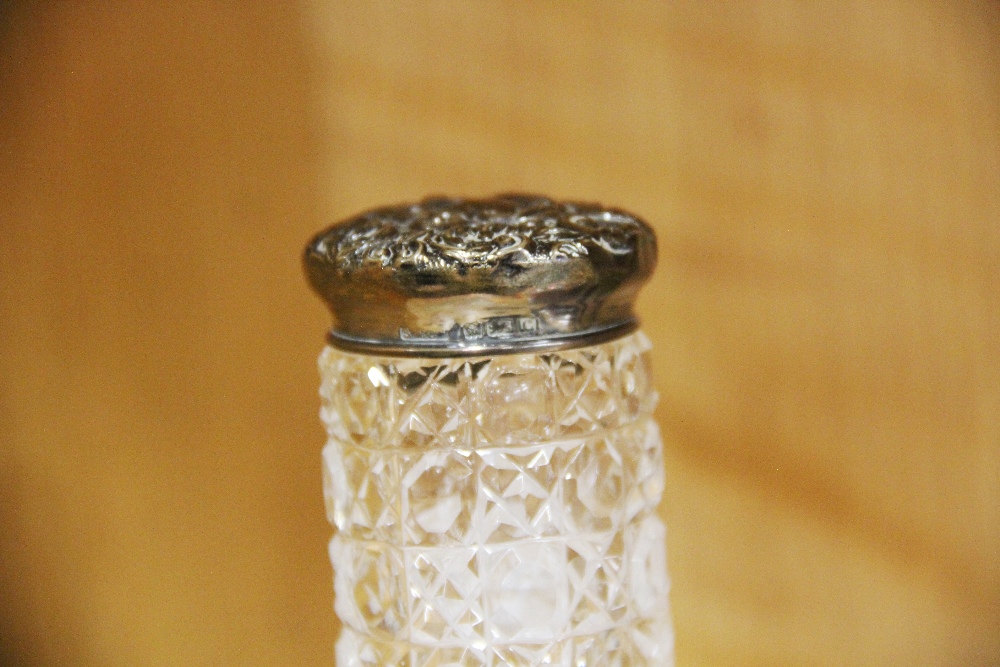 A silver topped cut glass dressing table bottle with a group of hat pins and other items. - Image 2 of 3