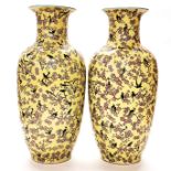 An interesting pair of large Chinese porcelain vases with yellow crackle glaze and enamel decoration