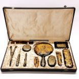An early 20th century Chinese cased tortoise shell dressing table set.
