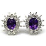 A pair of 925 silver cluster earrings set with oval cut amethysts and white stones, L. 1.7cm.