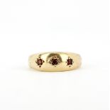 A hallmarked 9ct yellow gold ruby set ring, (N).