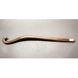 An interesting antique carved wooden long handled hook, L. 69cm. Prov. Estate of the late Dr.