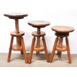 Three 1970's adjustable pine stools.