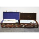 Four vintage leather cases of Masonic regalia.