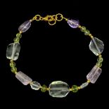 A gold on 925 silver bracelet set with polished rose quartz, green amethyst and peridot, L. 19.5cm.