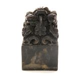 A heavy Chinese cast bronze scholar's seal decorated with dragons, H. 14cm.