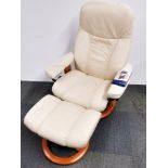 An Ekornes Stressless cream leather reclining armchair and footstool.