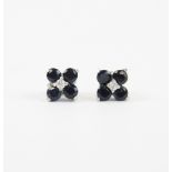 A pair of 925 silver stud earrings set with round cut black spinels and a white stone, L. 1cm.