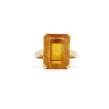 A 9ct yellow gold ring set with a large baguette cut citrine, (K).