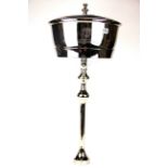 A large silver plated four bottle champagne ice bucket and stand, H. 78cm.