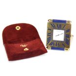 A lovely enamelled Cartier quartz travel clock with leather carrying pouch, clock size 5 x 6cm.