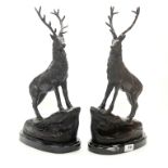 A pair of bronze figures of stags on grey marble bases after J. Moignier, H. 44cm.