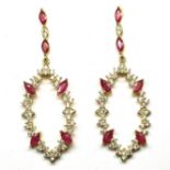 A pair of gold on 925 silver drop earrings set with marquise cut rubies and white stones, L. 5.8cm.