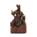 A Chinese carved hardwood figure, H. 35cm.
