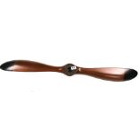 A reproduction hardwood and bronze aeroplane propellor, W. 100cm.