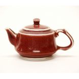 A Chinese sang de boeuf glazed porcelain teapot, spout to handle 16cm.