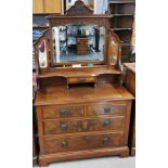 A 19th century carved mahogany dressing table with flame veneered drawer fronts, W. 105cm, H.