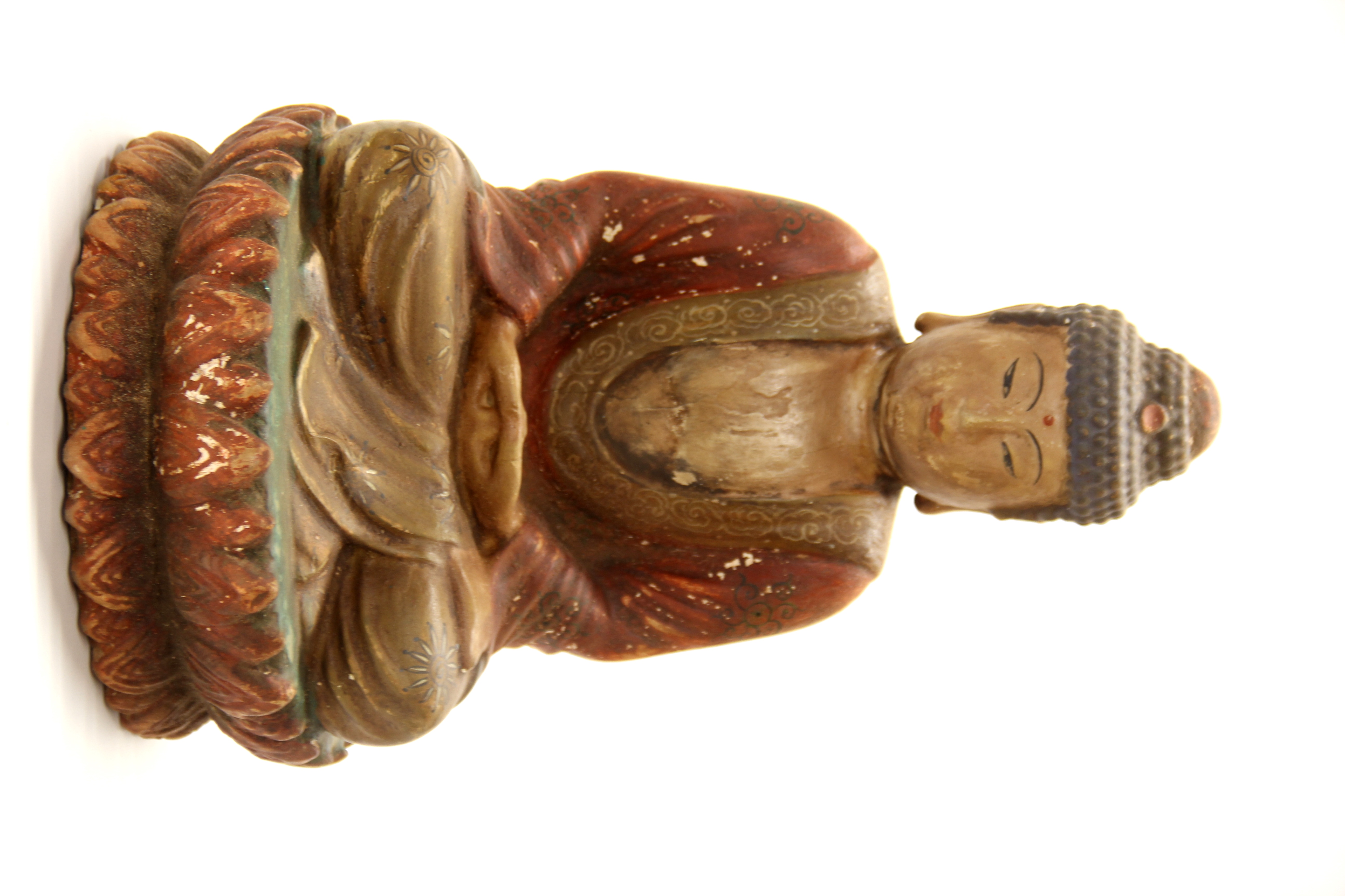 A Chinese painted carved wooden figure of a seated Buddha, H. 37cm.