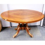 A 19th century inlaid mahogany and mahogany veneered tilt top oval tea table, 117 x 86cm.