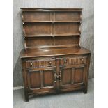 A vintage oak Welsh dresser with two tier plate rack, 166 x 130 x 50cm.