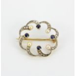 An antique 18ct gold and platinum brooch set with rose cut diamonds, round cut sapphires and seed