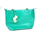 A Radley green leather handbag, W. 40cm, in a Radley outer bag.