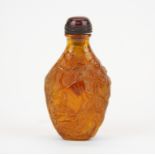 A reconstituted amber resin snuff bottle, H. 7.5cm.
