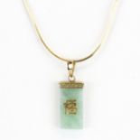 A hallmarked 9ct yellow gold jade set pendant with Chinese characters on a 9ct yellow gold chain, L.