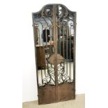 A wrought iron gate style garden mirror, H. 150cm.