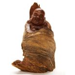 A Chinese carved root wood figure of Putai, H. 18cm.