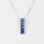 A 925 silver pendant set with square cut blue sapphire surrounded by cubic zirconias on a 925 silver