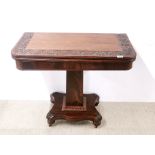 A carved mahogany fold out tea table, W. 86cm.
