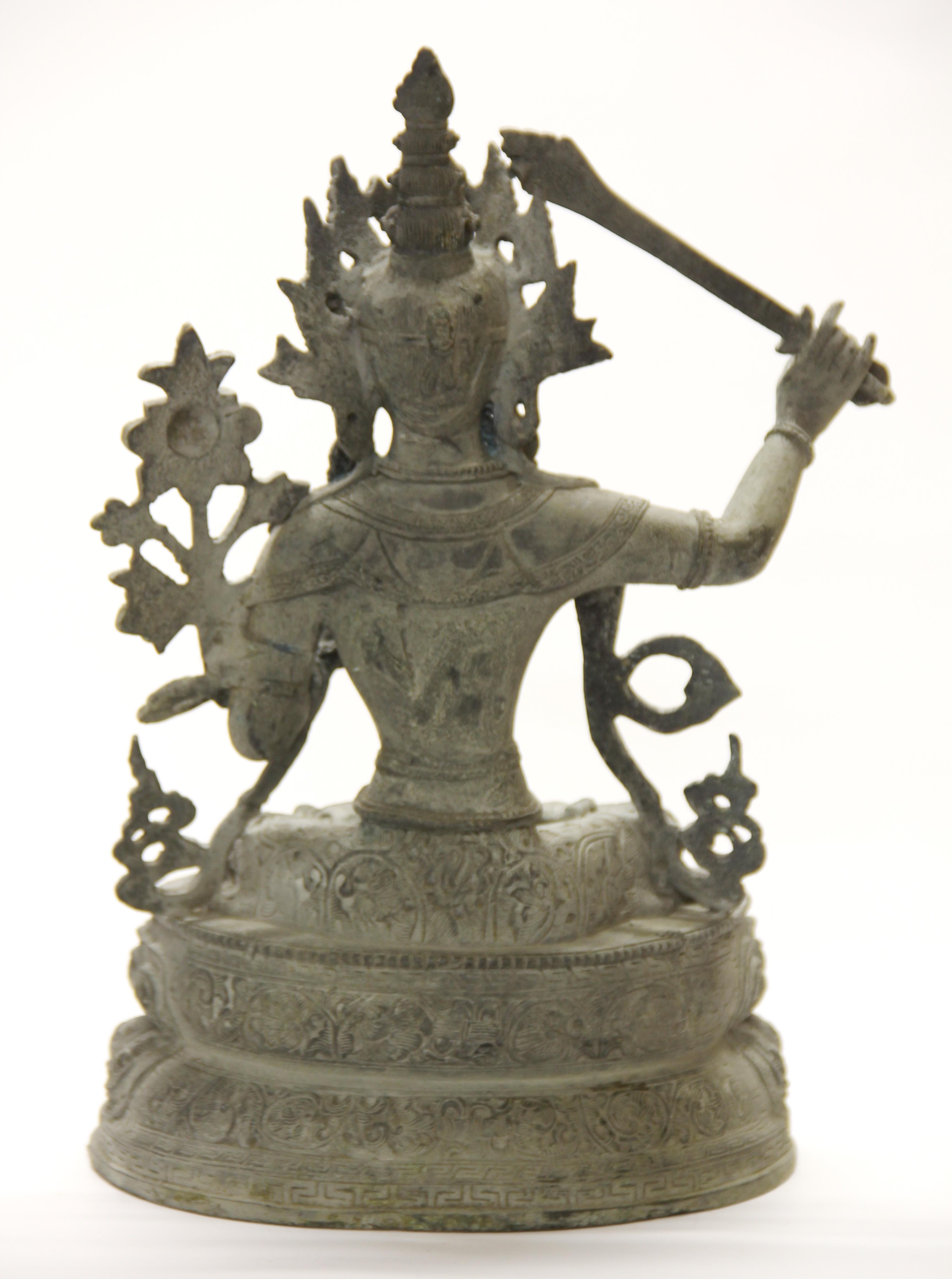 A large Tibetan bronze figure of a seated Tara, H. 38cm.
