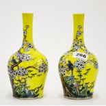 A fine pair of Chinese hand enamelled porcelain vases, H. 21cm.