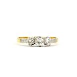 A yellow metal (tested 18 gold) ring set with three brilliant cut diamonds, approx. 0.50ct total, (