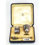 A cased hallmarked silver Asprey & Co christening set with replacement silver spoon and additional