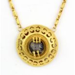 A yellow metal (tested high carat gold) necklace inset with a Roman style silver coin, L. 40cm.