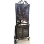 A late 19th century glazed mahogany corner cabinet, W. 78cm, (glass A/F to one door).