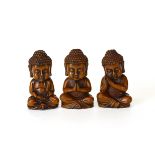 A set of three carved fruitwood figures of a young Buddha, H. 10cm.