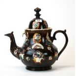 A large Staffordshire glazed pottery tea pot with an 1876 impressed date, H. 37cm (restoration to