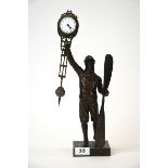 A bronze aviator pendulum clock, H. 38cm.
