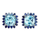 A pair of 925 silver earrings set with cushion cut blue topaz surrounded by sapphires, L. 1.1cm.