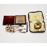 A small group of silver spoons and cheroot holder with a silver plated communion wafer case and