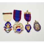 A group of mixed silver and enamelled medals.