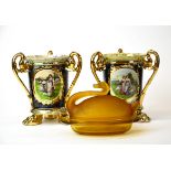 A pair of 19th century porcelain three handled vases (H. 20cm), with an amber frosted glass butter