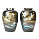 A pair of Japanese silvered and enamel decorated bronze vases, H. 21cm.