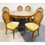An extending marquetry top dining table and six cane backed chairs, table L. 140cm, extending to