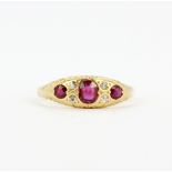 An antique 18ct yellow gold ruby and diamond set ring, (L).