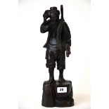 A Chinese carved hardwood figure of a craftsman, H. 40cm.